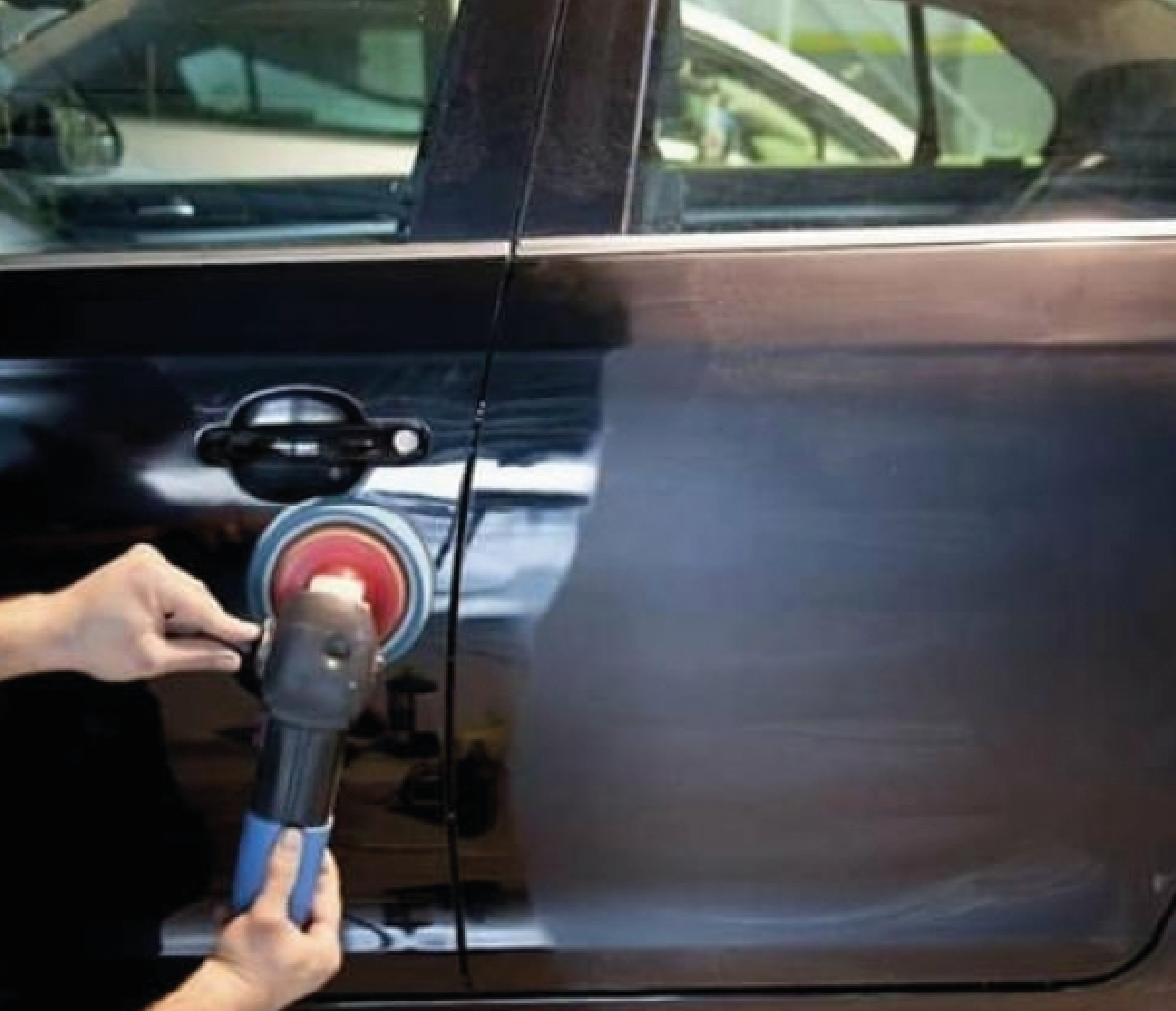 Close-up of a car headlight being polished