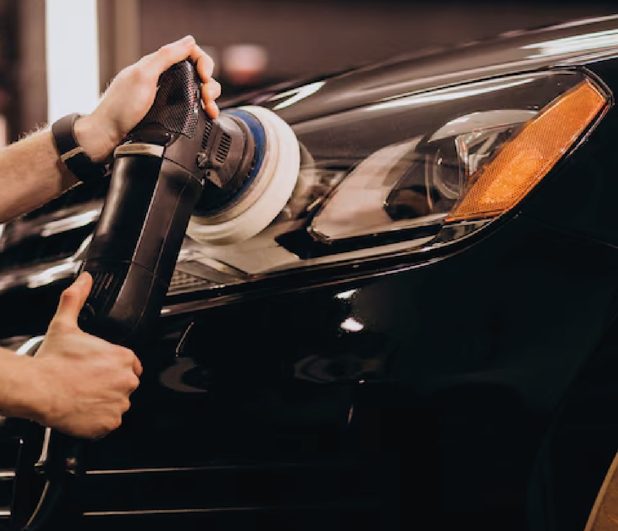 Person applying a coating to a car door